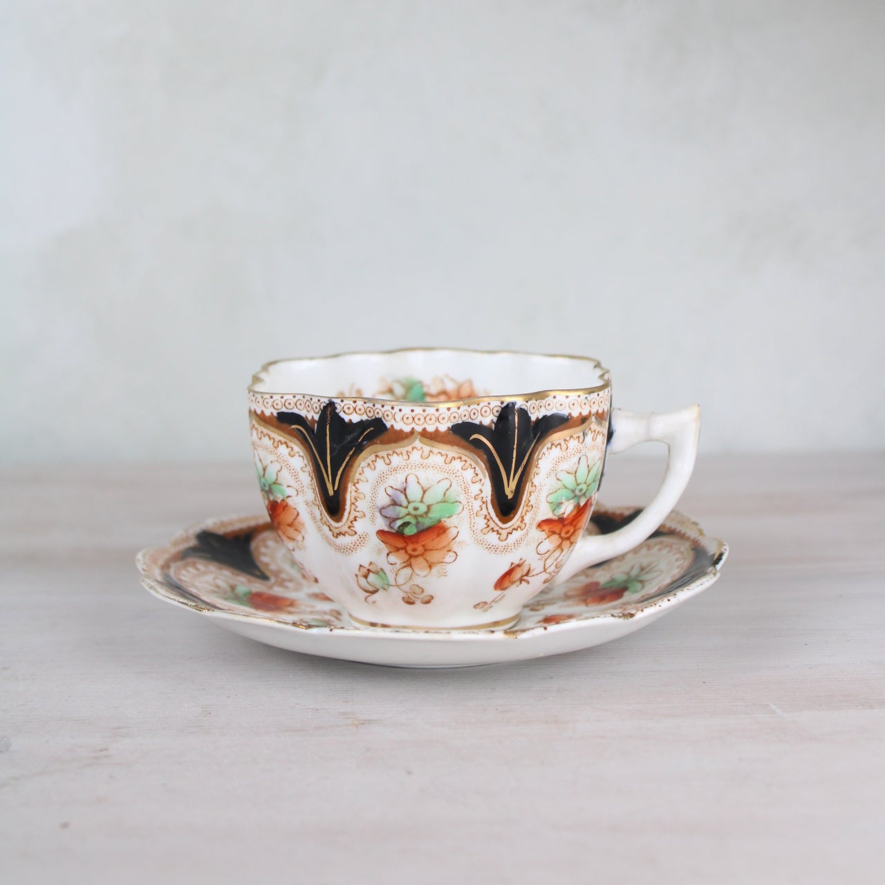 Orange and Black Vintage Teacup and Saucer