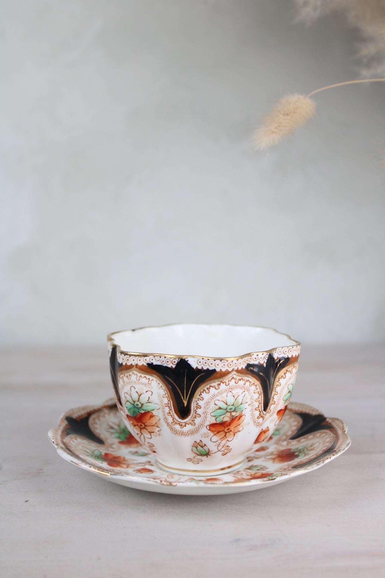 Orange and Black Vintage Teacup and Saucer