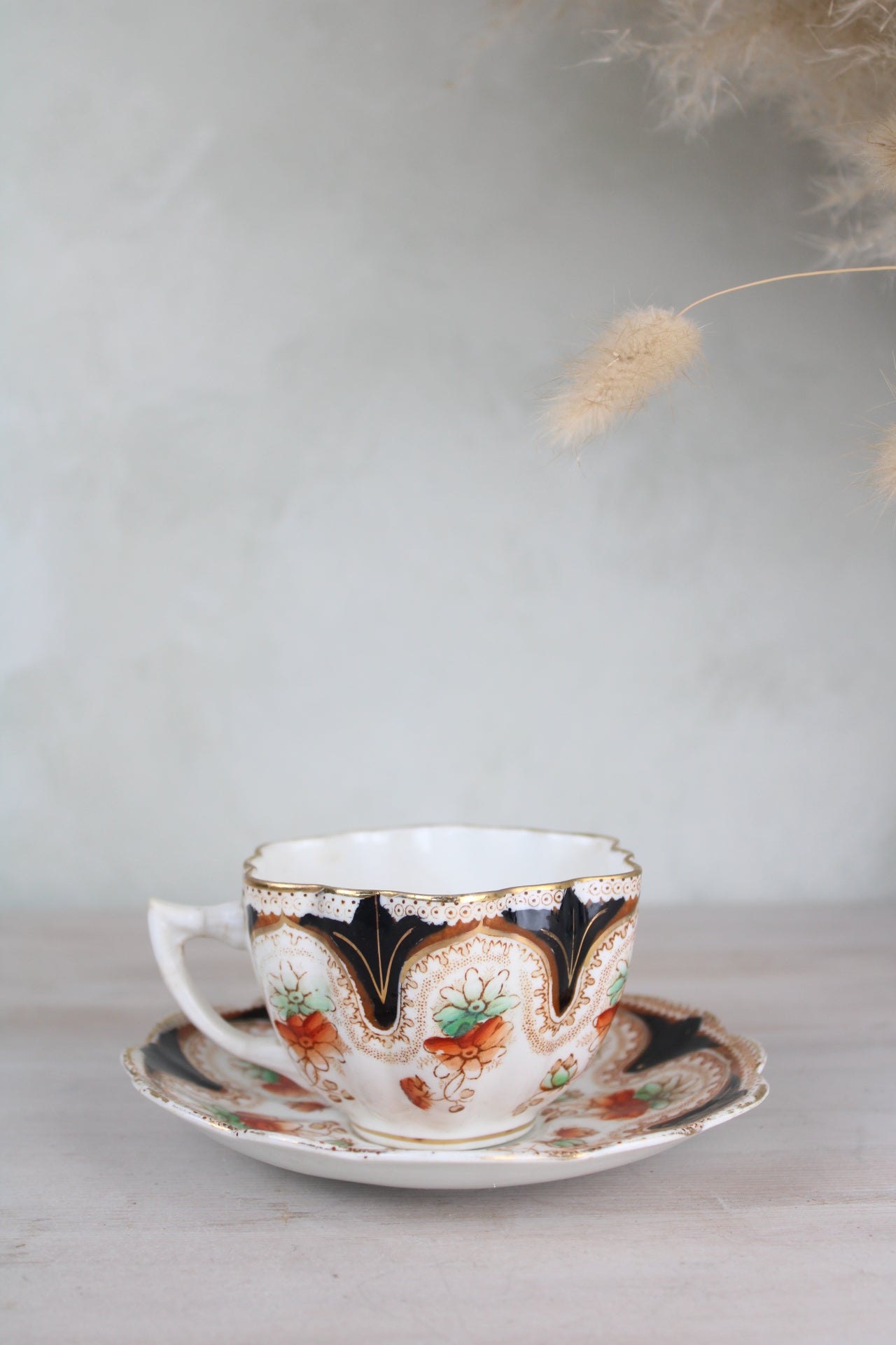 Orange and Black Vintage Teacup and Saucer