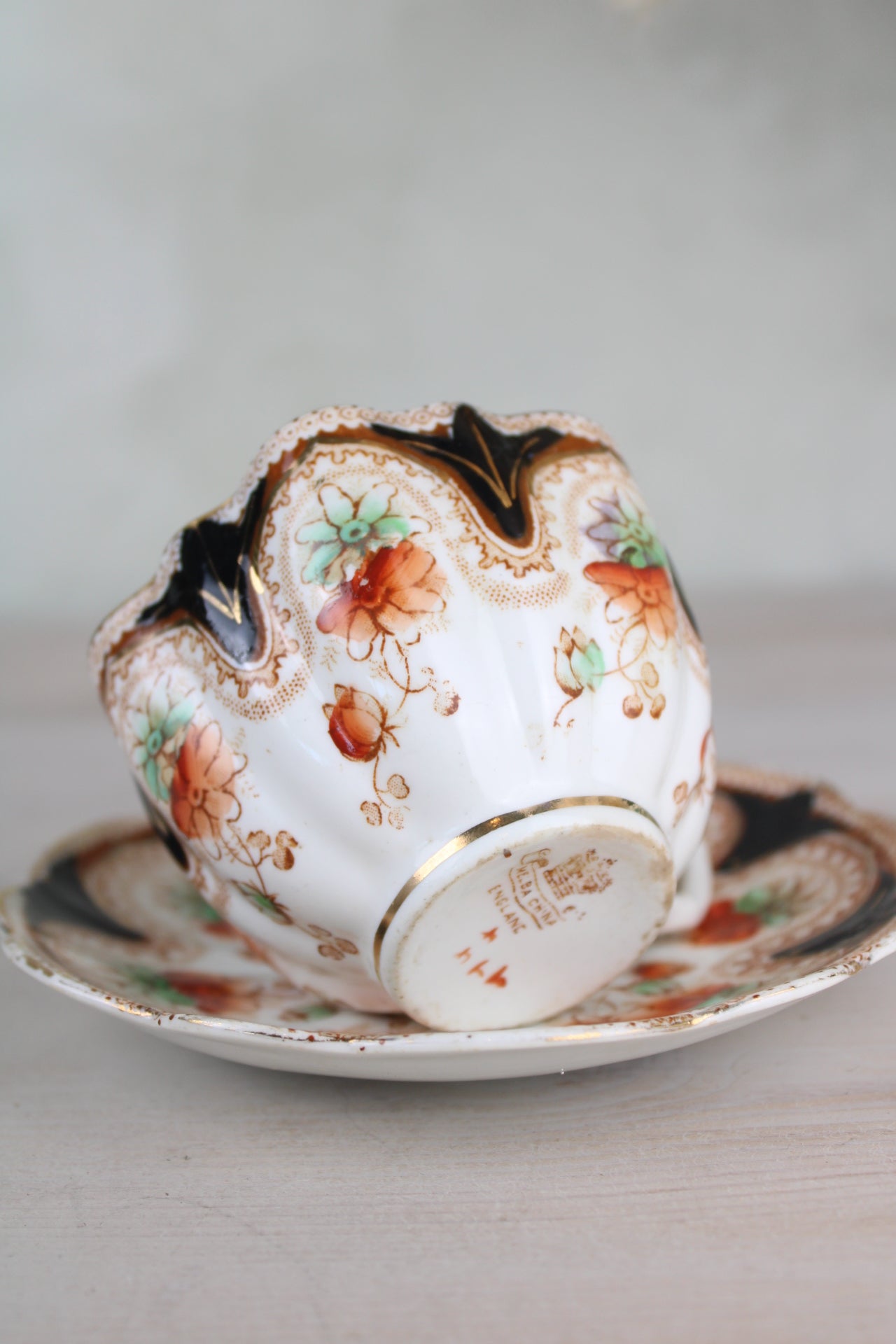 Orange and Black Vintage Teacup and Saucer