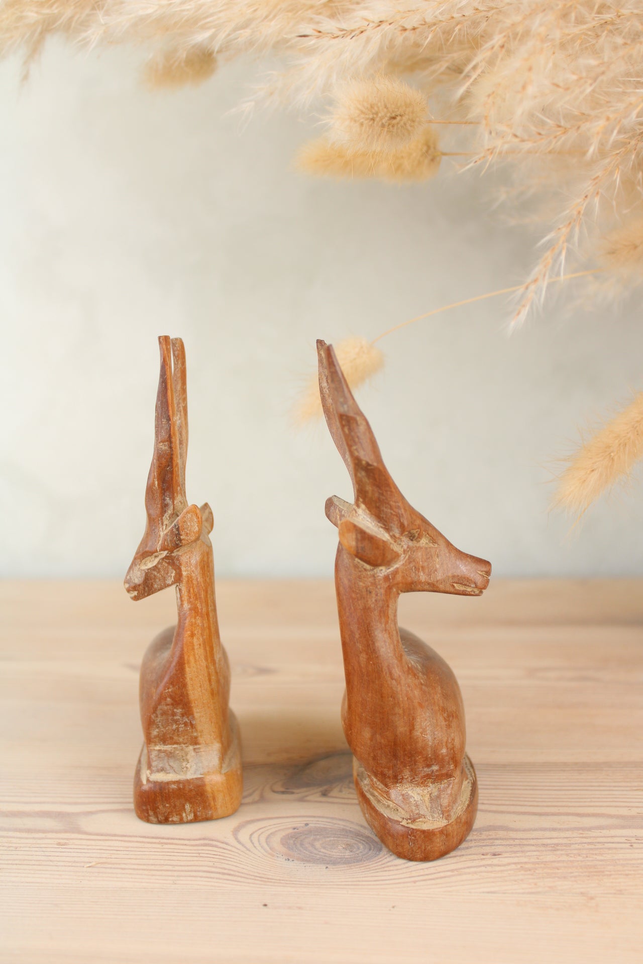 Pair of Sitting Wooden Stags