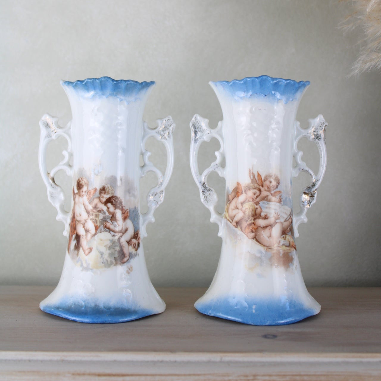 Pair of Cherub Design Vases