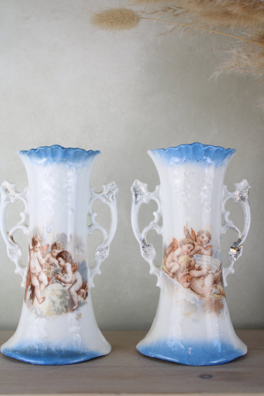 Pair of Cherub Design Vases