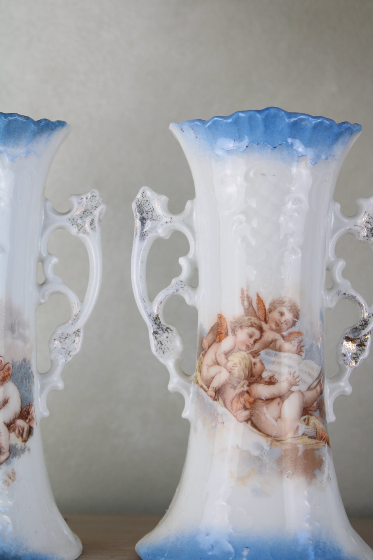 Pair of Cherub Design Vases