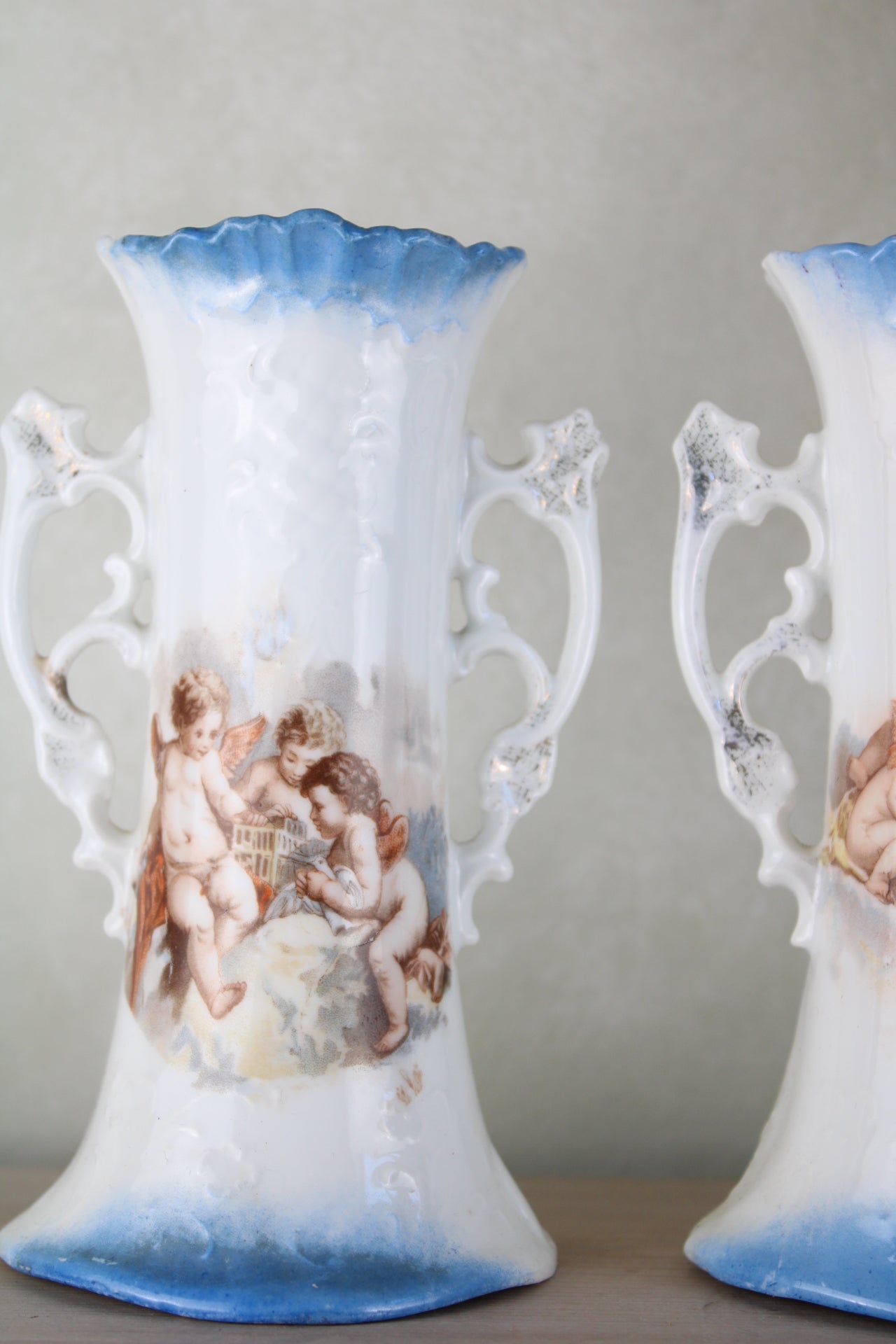 Pair of Cherub Design Vases