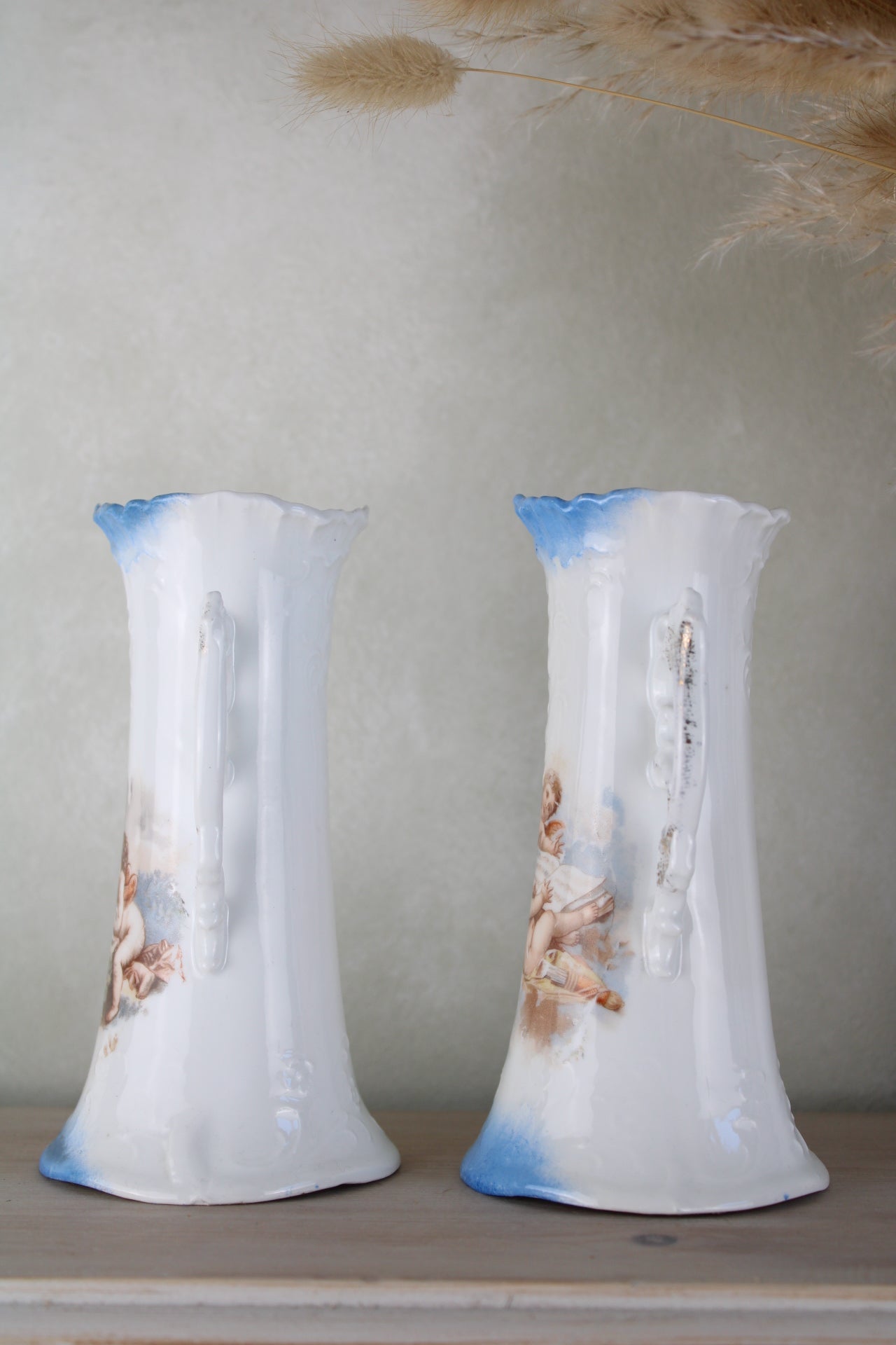 Pair of Cherub Design Vases