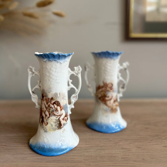 Pair of Cherub Design Vases