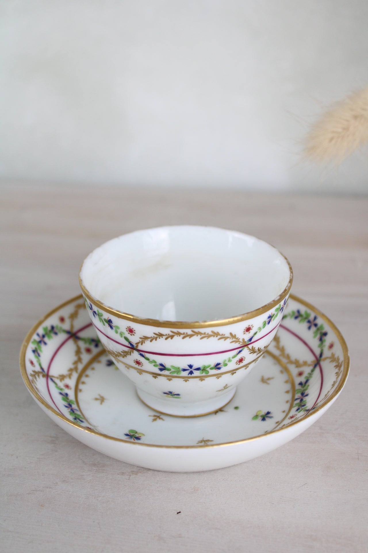 White and Gold Vintage Teacup and Saucer