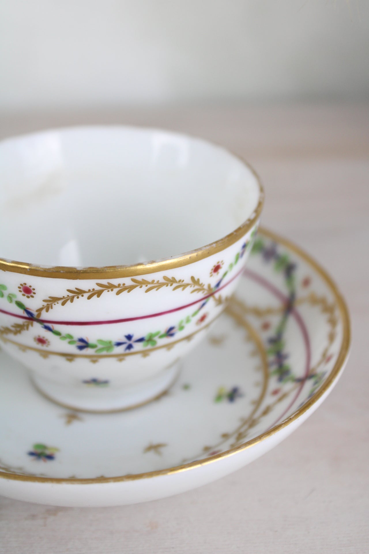 White and Gold Vintage Teacup and Saucer