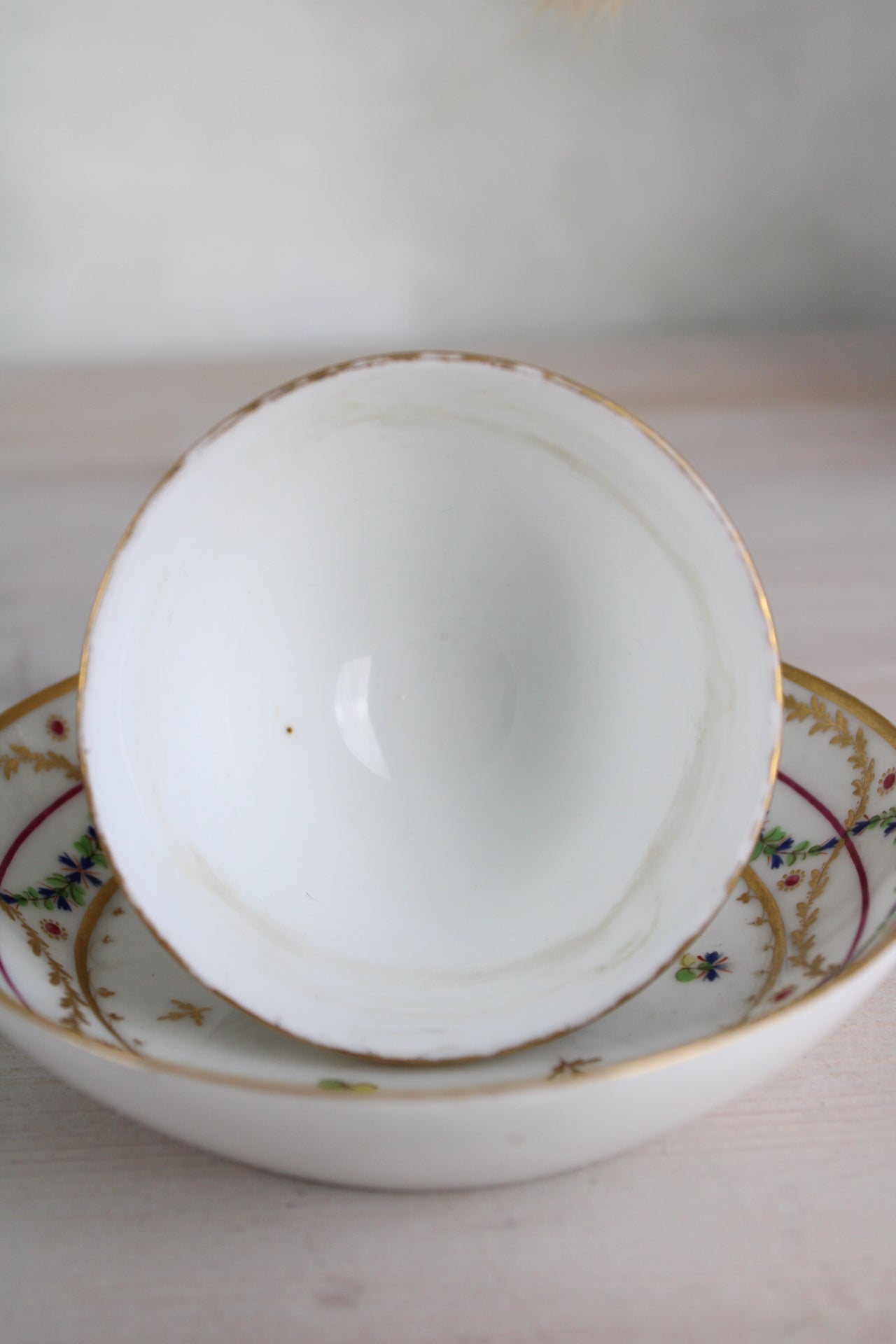 White and Gold Vintage Teacup and Saucer