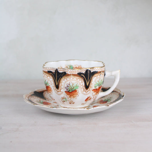 Orange and Black Vintage Teacup and Saucer