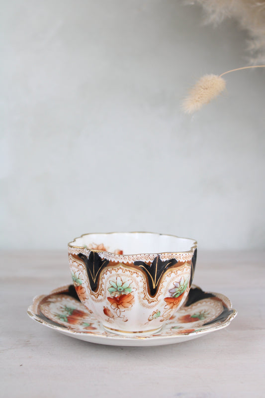 Orange and Black Vintage Teacup and Saucer